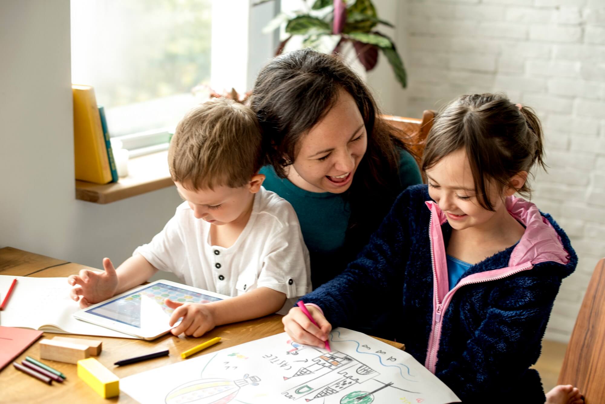 Mother teaching her kids at home
